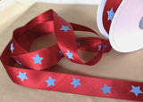 Red satin ribbon with blue stars.
