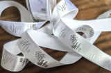 25mm wide White-metallic Silver "Mr & Mrs" Wedding Print Satin Ribbon by Berisfords Ribbons