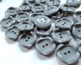 23mm mid grey nylon 2 hole button. Sold individually, buy the exact quantity of buttons required at Ribbonmoon online haberdashery.