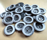 23mm frosted grey glossy 2 hole button. Sold individually, buy the exact quantity of buttons required at Ribbonmoon online haberdashery.