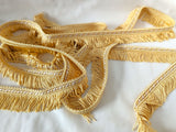 35mm Lampshade and soft furnishing trimming. Pale gold fringe trim with a cream in the corded braid. Ribbonmoon trims online shop.