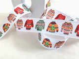 25mm wide white rustic taffeta ribbon with a festive Christmas jumper print.