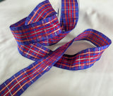 40mm wide wire edge tartan ribbon. Purple, red , blue with thin gold metallic stripes. UK made and cut and sold by the metre. Ribbonmoon ribbons online shop.