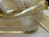 Gold mesh ribbon with solid and tinsel stripes. Sold by the metre with quantity discounts on 10 metre lengths. Buy ribbons online at ribbonmoon