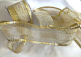 Gold mesh ribbon with solid and tinsel stripes. Sold by the metre with quantity discounts on 10 metre lengths. Buy ribbons online at ribbonmoon
