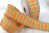 A 40mm wide plaid tartan ribbon with an oatmeal-colored base, featuring vibrant neon stripes in orange, green, yellow, and pink.