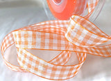 Orange and white sheer nylon traditional gingham ribbon. 15mm width.