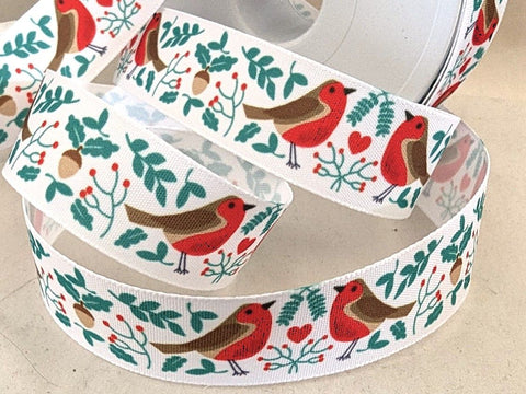 A 25mm wide white rustic taffeta ribbon featuring a charming Christmas robin theme print.