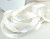 Berisfords bridal white satin ribbon. 10mm width, double face, polyester. Buy by the metre and cut to the length you require. Ribbonmoon ribbons online shop.