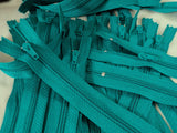 Closed end zips. 15cm long, no.3 size nylon centre fastening and jade green polyester fabric.