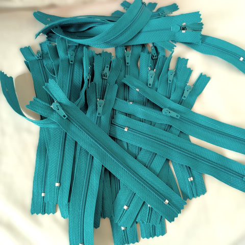 Closed end zips. 15cm long, no.3 size nylon centre fastening and jade green polyester fabric.
