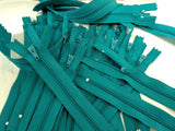 Closed end zips. 15cm long, no.3 size nylon centre fastening and jade green polyester fabric.