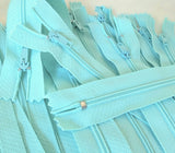 Closed end zips. 18cm long, no.3 size nylon centre fastening and turquoise polyester fabric.