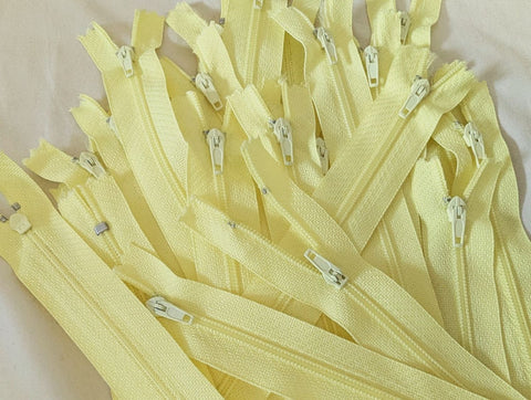 Closed end zips. 18cm long, no.3 size nylon centre fastening and primrose yellow polyester fabric.