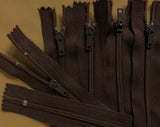 6" Dark Brown zips. 15cm skirt clearance line
