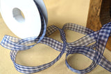 Royal blue and white organza gingham ribbon unrolled for display