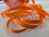 Orange satin ribbon with picot edge 