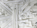 Closed end zips. 18cm long, no.3 size nylon centre fastening and bridal white/ivory polyester fabric.