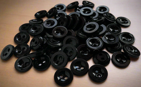 11.4mm Black Two Hole Button
Gloss Nylon with a Concave Centre and Flat Rim