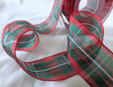 Roll of 40mm Berisfords MacGregor Tartan organza ribbon, semi‑transparent with a classic red and green tartan design.