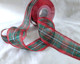 Close‑up of MacGregor Tartan organza ribbon, showing the sheer weave and detailed red, green and white tartan pattern.