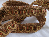 Thick vintage upholstery braid trim in brown and gold, 29mm wide with chunky woven texture.