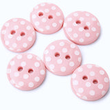 15mm pale pink polyester two hole buttons with white polka dots