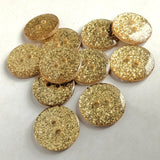 18mm round glittery gold button with two holes, shown on a white background.