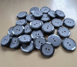 23mm grey iced matt & pearlised polyester 2 hole button. Sold individually, buy the exact quantity of buttons required at Ribbonmoon online haberdashery. Quantity discounts.
