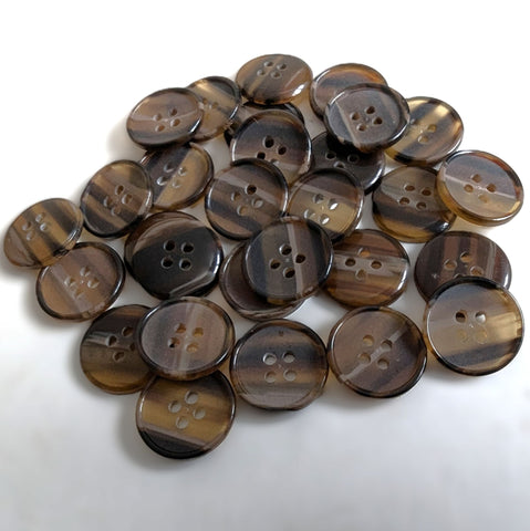 19mm polyester four‑hole button featuring a matte, slightly translucent centre in tonal brown shades, surrounded by a raised glossy rim. The back of the button is lightly domed with a high‑gloss finish.