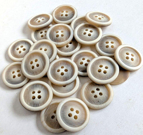 20.5mm width four hole button with a bone sheen and raised ringed rim. Frosted toffee brown with a grey element.