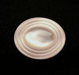17mm oval pearlised polyester shank button with a ringed rim and domed centre.