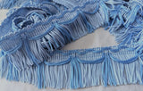 Two tone blue fringing with a silky sheen. 50mm width.

