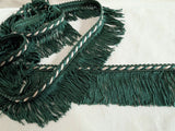 50mm Lampshade and soft furnishing trimming. Dark green fringe trim with a cream pearl in the corded braid. Ribbonmoon trims online shop.