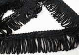 Black 35mm looped fringe on a decorative braid.