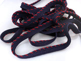 Navy blue rope with red stitching on a white background