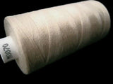 Cream 70 Coats Moon Spun Polyester Sewing Thread on 1000 yard spool for machine and hand sewing projects.