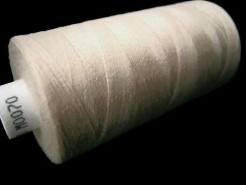 Cream 70 Coats Moon Spun Polyester Sewing Thread on 1000 yard spool for machine and hand sewing projects.
