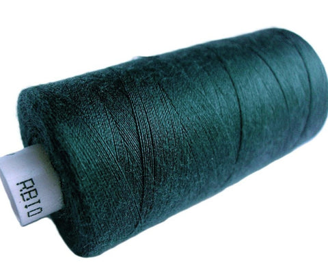 Deep teal 43 Coats Moon Spun Polyester Sewing Thread on 1000 yard spool for machine and hand sewing projects.