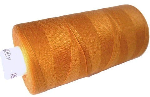 Orange gold 73 Coats Moon Spun Polyester Sewing Thread on 1000 yard spool for machine and hand sewing projects.