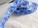 Berisfords Capricorn constellation ribbon with blue starry print, available by the metre or 10m lengths