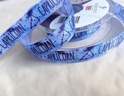 Berisfords 15mm Capricorn zodiac sign printed taffeta ribbon in blue with constellation design