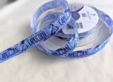 Blue Capricorn star sign ribbon by Berisfords, 15mm wide printed taffeta for crafts and gift wrapping