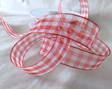 Close‑up of red and white 15mm sheer gingham ribbon showing fine translucent weave.