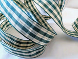15mm wide green & cream tartan ribbon with this gold metallic stripes. Wire edges & high quality, made by Berisfords Ribbons in the UK. Sold per metre & cut to length with quantity discounts.