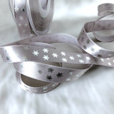15mm silver grey satin ribbon with a metallic snowflake festive print