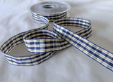 15mm Navy, cream wire edge tartan ribbon with thin metallic gold stripes. Berisfords Ribbons, shop per metre or discount lengths online.