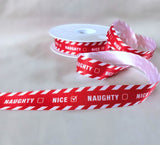 Red and white 16mm Naughty or Nice  Christmas printed satin ribbon by Berisfords Ribbons UK