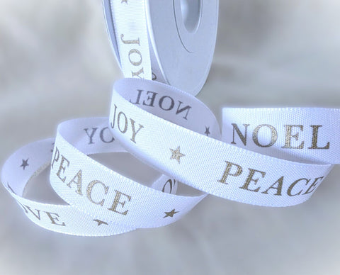 White Berisfords Christmas ribbon with metallic Joy, Peace, Love and Noel lettering and small stars.