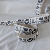 Berisfords premium quality pale beige rustic cotton look polyester taffeta ribbon with a graphite Christmas motif print. 25mm wide. Cut to length at Ribbonmoon Haberdashery Shop.